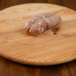 Soppressata stagionata artigianale su tagliere di legno.