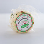 Confezione di prataiola alla rucola, peperoncino e olive Moscato appoggiata in verticale